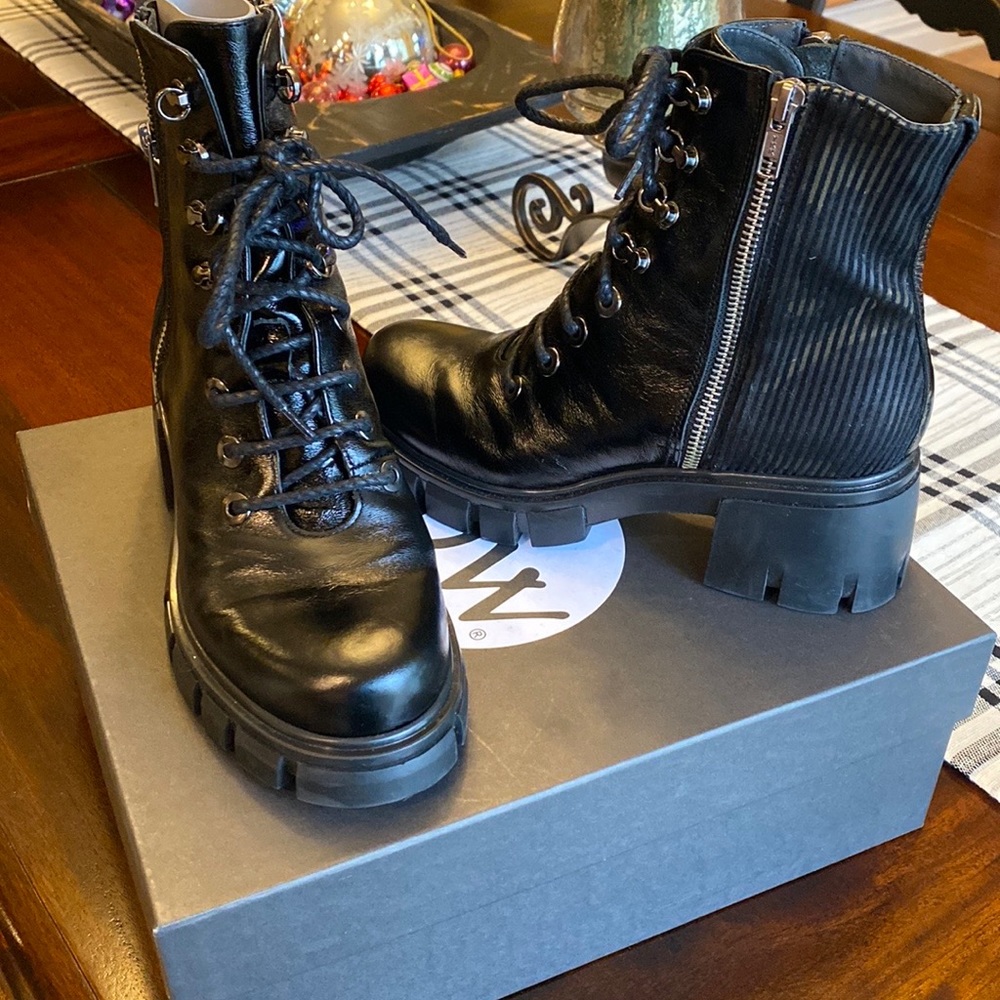 Black lug sole combat boots . Italian designer NOW.